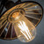 Close-up of a vintage ST64 LED filament light bulb with a squirrel cage design, installed in a stylish interior fixture for a warm retro ambiance in Australian homes.