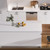 Modern white DIY kitchen cabinetry with base and wall cabinets featuring a sleek finish for home renovations in Australia.