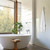 Modern Aguzzo Ezy Fit brushed nickel tree-style vertical heated towel rail installed in a contemporary Australian bathroom.