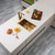 Modern brushed gold stainless steel single half bowl kitchen sink with topmount installation for contemporary Australian homes.