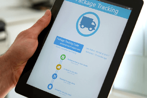 Hand holding tablet showing real-time tracking progress app