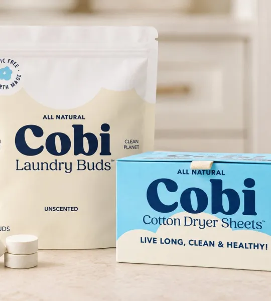 Cobi Laundry Buds pouch and Cotton Dryer Sheets box on a laundry room counter