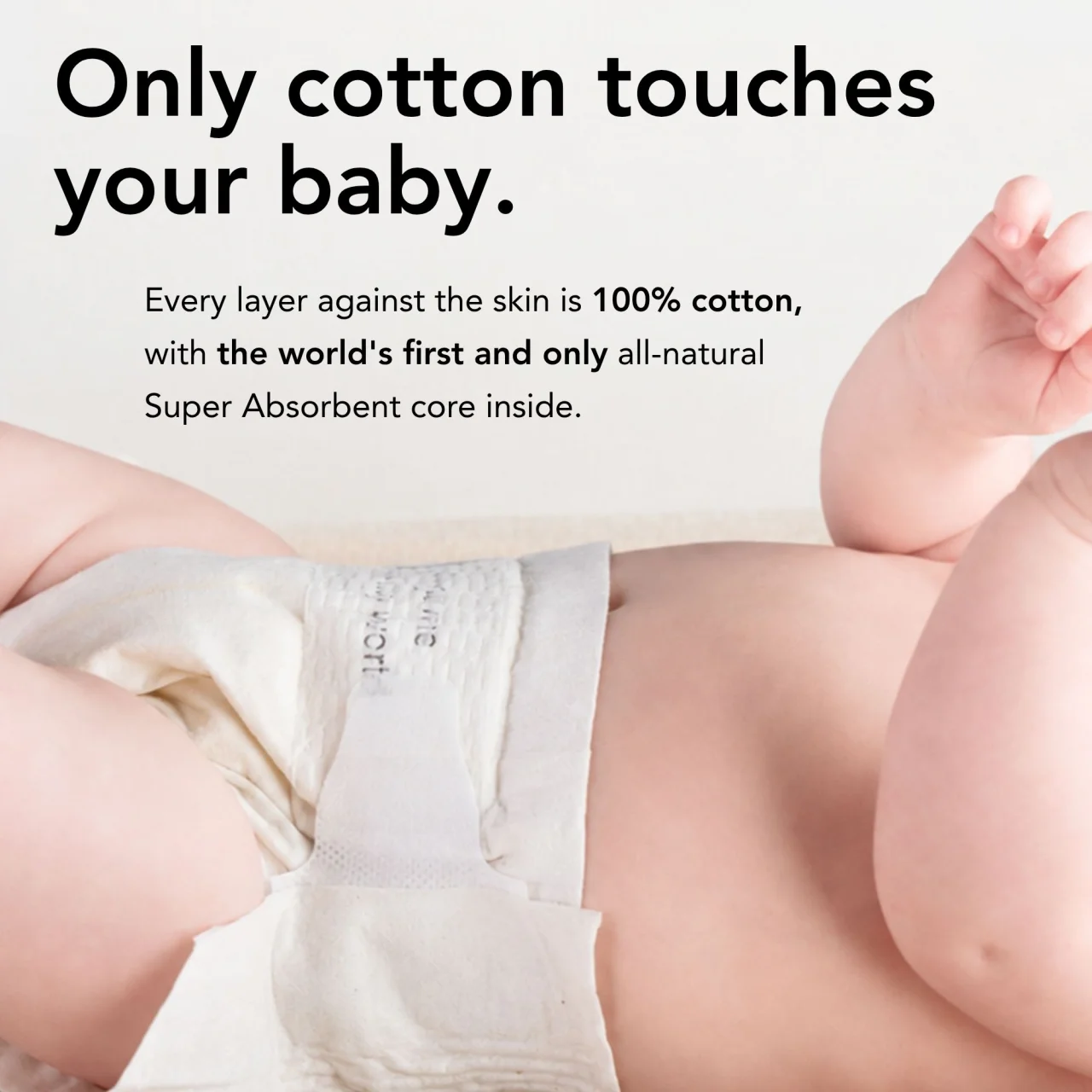 Only cotton touches your baby. A baby lying down in a Change cotton diaper.