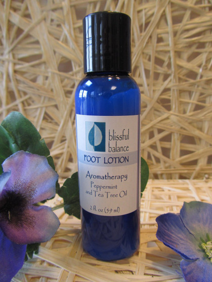 Peppermint foot lotion in a blue Blissful Balance bottle with purple flowers