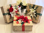 Three 12 x12 x 4" straw colored baskets decorated for the holidays with red and white flowers. 