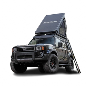 A Land Cruiser 1958 edition with a roof rack and tent on its roof, over a plain white background. A Land Cruiser 1958 edition with a roof rack and tent on its roof, over a plain white background.
