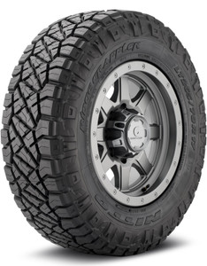 A Nitto ridge grappler all terrain tire mounted on a gray aluminum wheel for a Toyota Land Cruiser. A Nitto ridge grappler all terrain tire mounted on a gray aluminum wheel for a Toyota Land Cruiser.