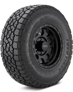 Toyo's Open Country AT3 mounted on a black bullet hole-style rim over a plain white backdrop. Toyo's Open Country AT3 mounted on a black bullet hole-style rim over a plain white backdrop.