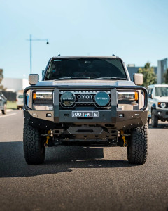 A Meteor Shower LC250 sporting its bull bar / full hoop front bumper by The Cruiser Company.