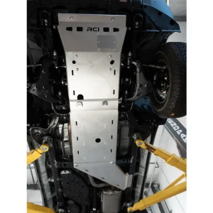 An installed bare aluminum skid plate set for the 250 series Toyota Land Cruiser (2024+).
