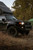 A black Land Cruiser 250 in nature with a roof top tent. A black Land Cruiser 250 in nature with a roof top tent.