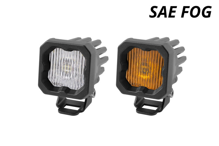A pair of Diode Dynamics State Series Compact 1" LED pods; the left one in white color and the right in selective yellow color. A pair of Diode Dynamics State Series Compact 1" LED pods; the left one in white color and the right in selective yellow color.