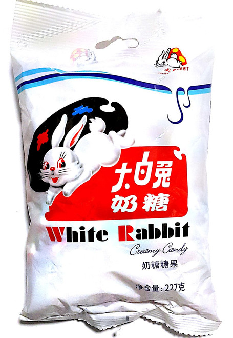 A vibrant photo showcases a packet of White Rabbit candy, the iconic Chinese confectionery featuring rich, milky sweets individually wrapped in edible rice paper, evoking nostalgia and enticing taste buds.