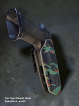 Miami Tiger Stripe wrapped OWB holster with Speedlock Level 2 retention, shown from the rear with adjustable belt attachment and full-size pistol.