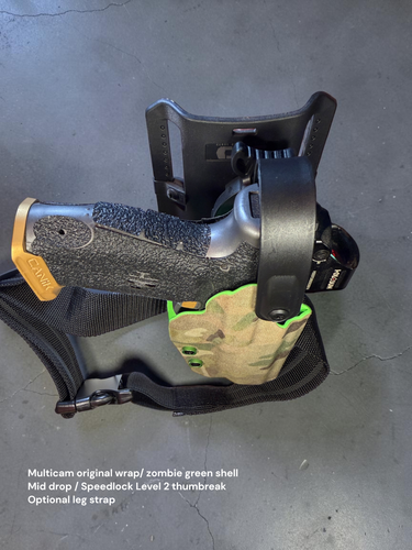Rear three-quarter view of a single-layer mid-drop OWB holster with Multicam Original Cordura wrap, Zombie Green shell, Speed Lock Level 2 spring-assisted retention hood, and optional adjustable leg strap mounted to a Canik pistol.