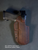 OWB Level 3 retention holster with dark brown genuine leather wrap over black Kydex, featuring SLS and Sentry Lock retention with optional optic cut.