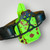 Close Quarters Carry IWB/OWB conversion holster in neon green blood-splatter  finish with red anodized hardware and Qualifier Strap installed for OWB belt carry.