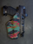 Suppressor-friendly OWB holster for a Walther PDP featuring a colorful camouflage wrap with black hardware. Open-top design uses light-based retention and provides clearance for a mounted suppressor and red dot optic.