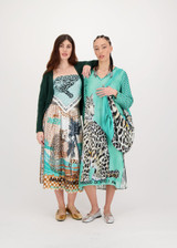 ME369 Safari Vanessa pleated midi skirt with intricate graphic artwork, elastic waist, and dotted hemline for a flowing, expressive look.