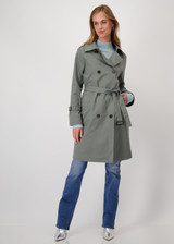 MONARI forest green trench coat with double button placket, waist belt, and decorative chain detail. MONARI forest green trench coat with double button placket, waist belt, and decorative chain detail.