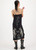 ME369 Magic Dorothy black camisole dress with spaghetti straps, featuring tigers, snakes, flowers, and moons in the Black Magic print, with a long snake design on the back.