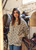 Lauren Vidal BIC printed quilted jacket with a bronze lining, designed to be worn open or belted with a brown leather belt for a versatile, chic look.