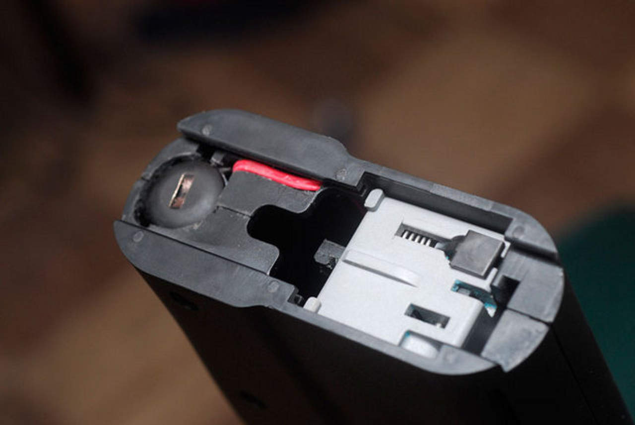 PS90 laser battery above trigger pack.