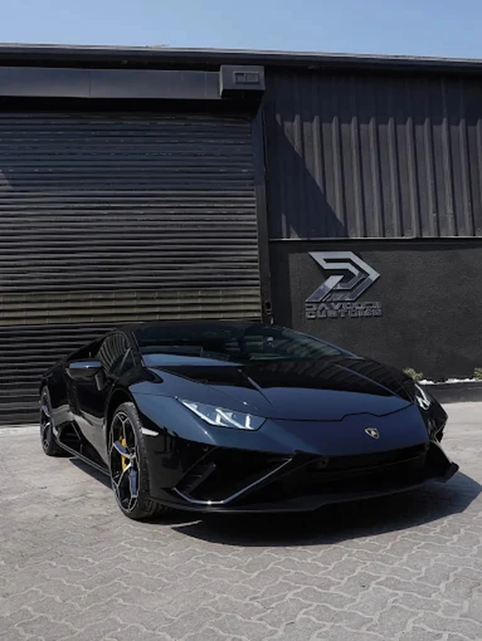 Matte black Lamborghini Huracan with custom wrap by Davoodi Customs Dubai
