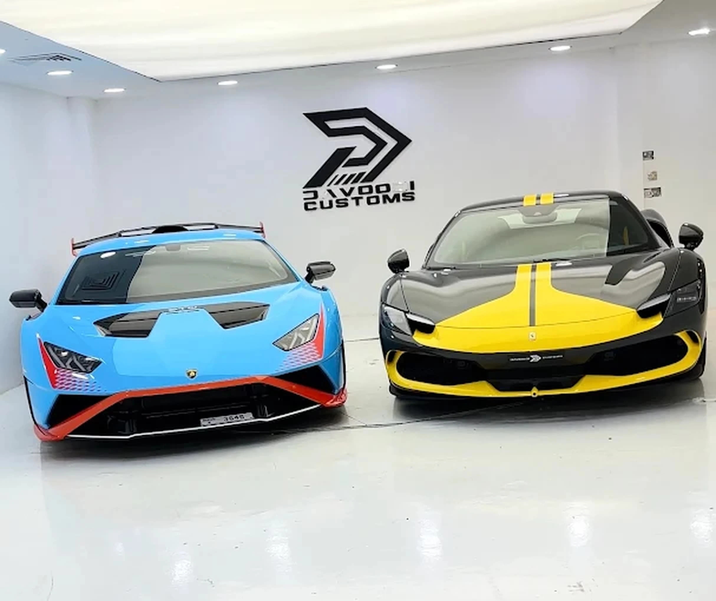 Custom wrapped vehicles on display at Davoodi Customs Al Quoz showroom