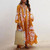Rejea Loose Fit Long Sleeve Flower Dress Tassel V Neck Beach Sundress Fashion Lace-up Tassel Casual Long Dress Women Autumn Dresses