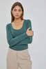 Picture of woman wearing a long sleeve scoop neck t-shirt