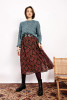 Woman wearing paisley midi skirt