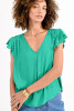Picture of model wearing a ruffled sleeve kelly green Molly Bracken Blouse