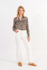 Picture of woman wearing white Molly Bracken Kick Flare Jeans in white