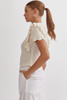 Picture of woman wearing short sleeve ruffle off white sweater