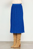 Picture of woman wearing a blue pleated midi skirt