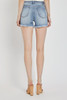 Picture of woman wearing high rise distressed shorts under $50