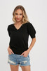 Picture of model wearing a v-neck puff sleeve short sleeve sweater in black
