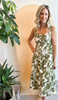 Picture of woman wearing leaf print midi dress