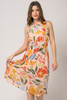 Picture of woman wearing a cut out high neck blush floral dress
