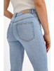 Picture of woman wearing lightwash bootcut flare jeans by Molly Bracken