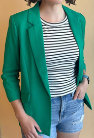 Picture of a woman wearing a ruched sleeve blazer