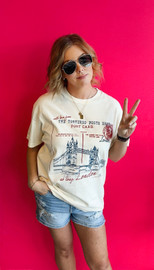 Picture of woman wearing an oversized graphic tee that reads So Long, London