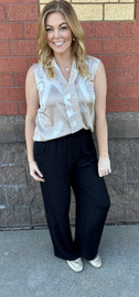 woman wearing wide-leg pant with brush stroke sleeveless blouse