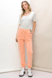 Picture of woman wearing peach joggers