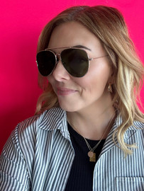 Picture of woman wearing reverse aviator sunglasses