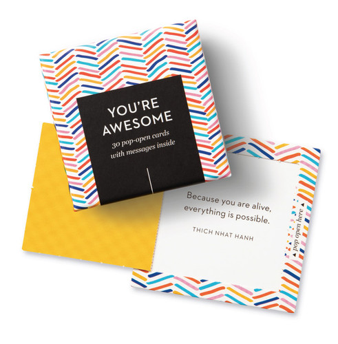 Closeup picture of paper cards that pop open with an inspirational message