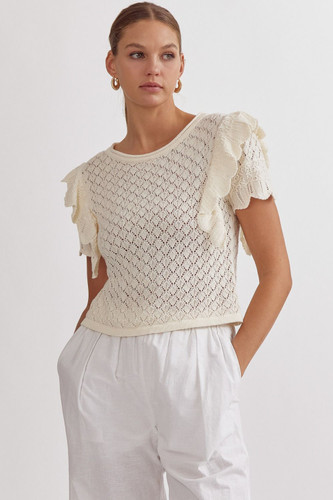 Picture of woman wearing short sleeve ruffle off white sweater