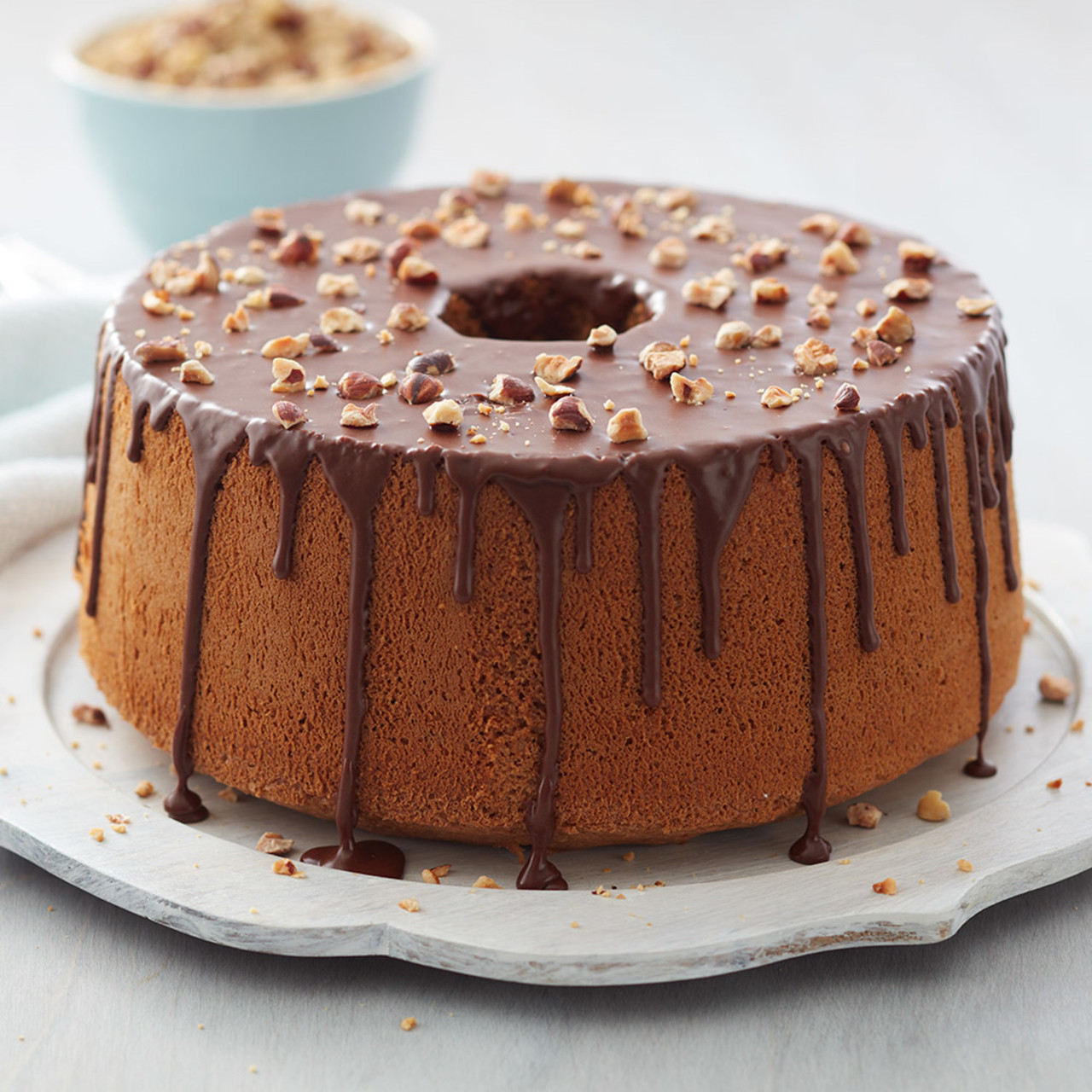 Mocha hazelnut cake. I feel like I'm getting better at drips, but I wanted  the frosting to be 3 defined colours and it all just smeared together...  any advice? : r/Baking