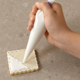 Covering a Cookie with Cookie Icing Covering a Cookie with Cookie Icing